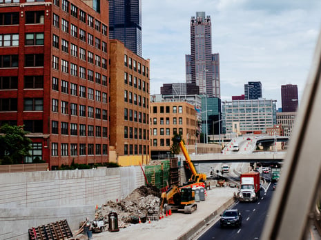 vehicles-on-road-near-building-2225246